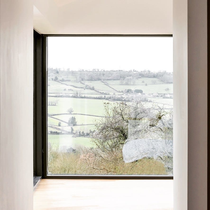 Large window with picturesque view through valley