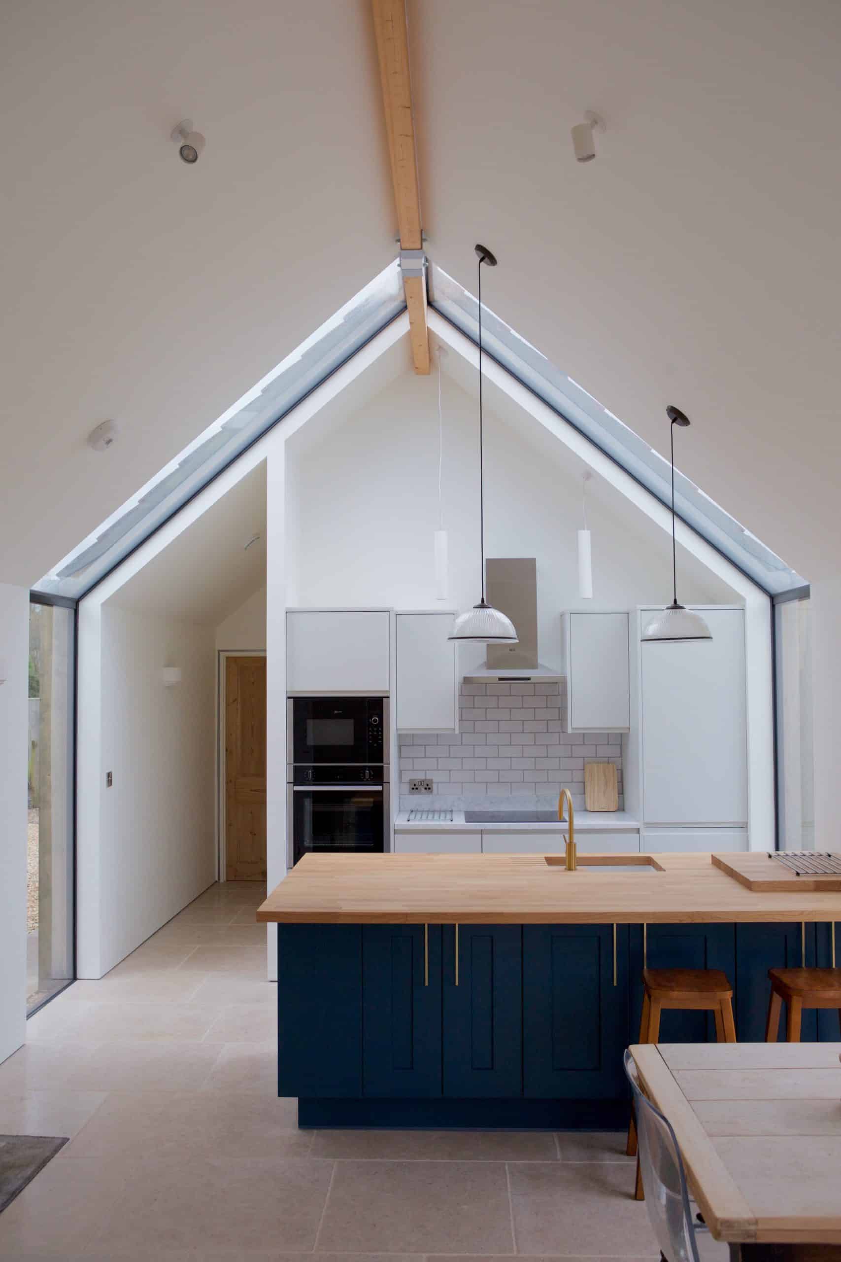 Modern, bright kitchen with apex roof