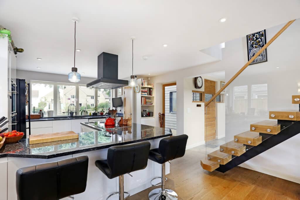 modern kitchen with bespoke stairs architect self build eco house