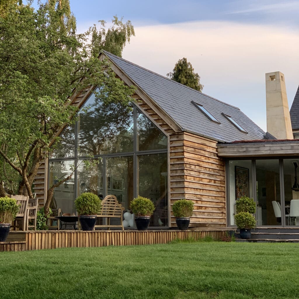 glazed gable end with timber cladding self build eco house