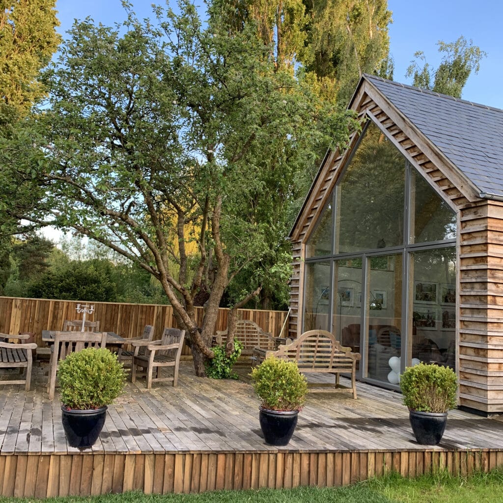 wooden deck area and glazed gable end self build eco house