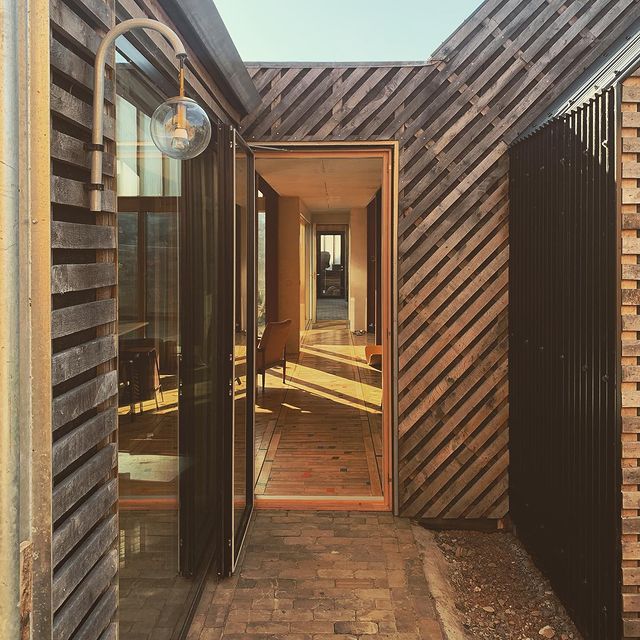 entrance way to architect designed house timber cladding
