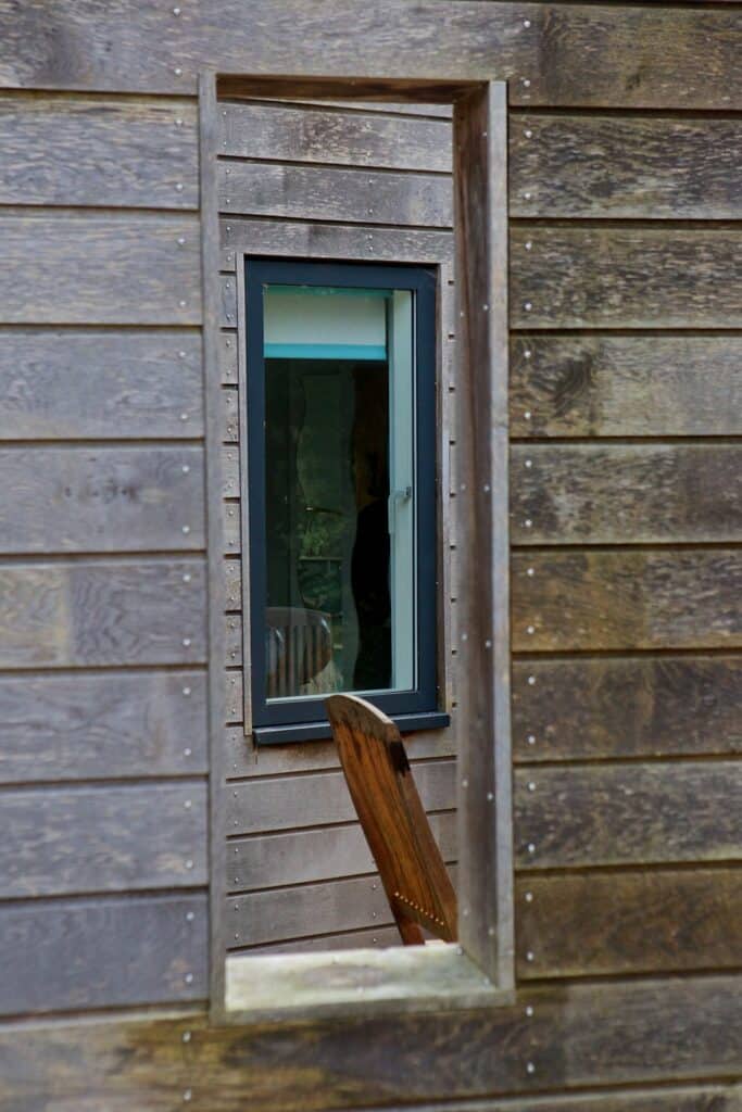 window through wooden cladding privacy screens