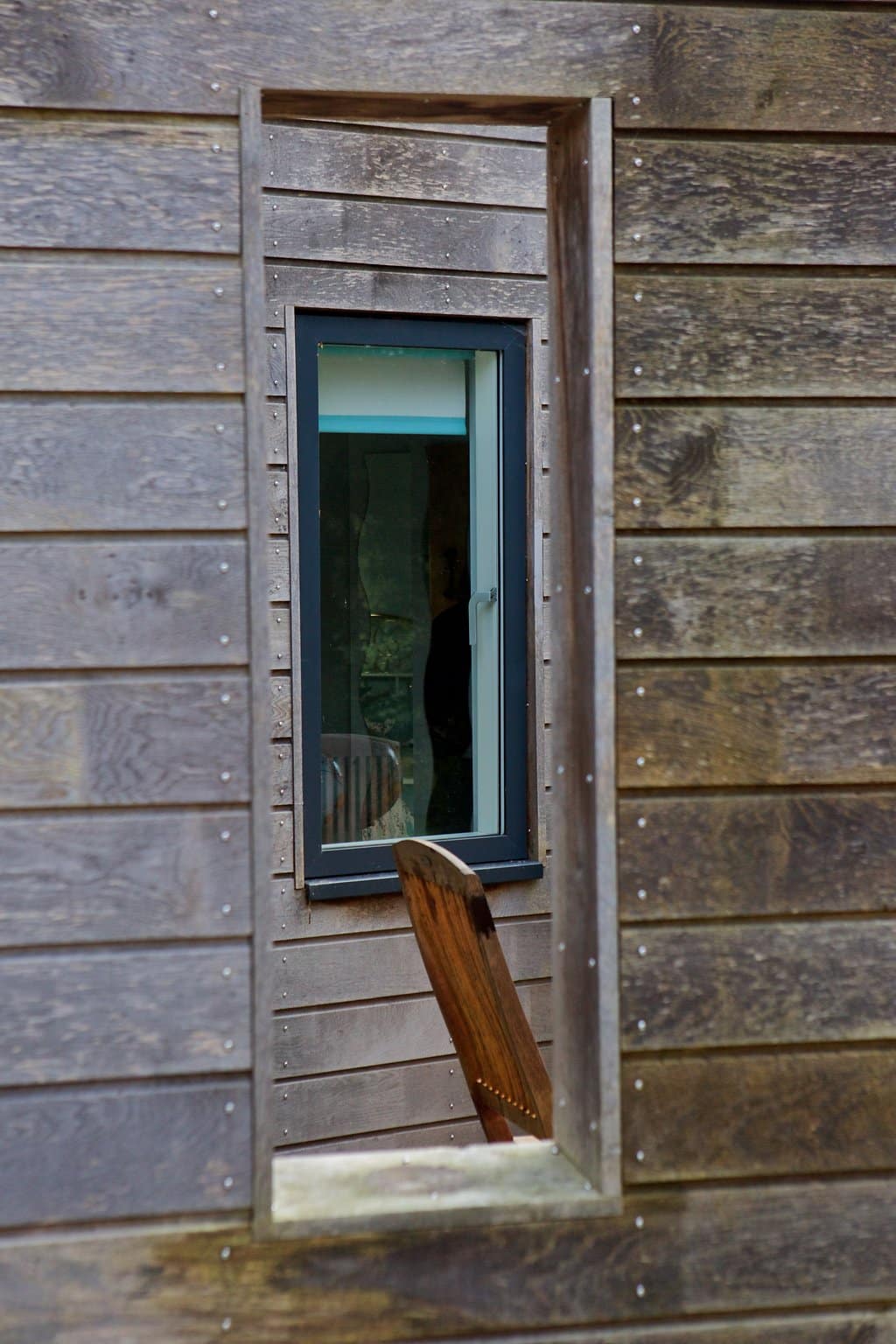 window through wooden cladding privacy screens