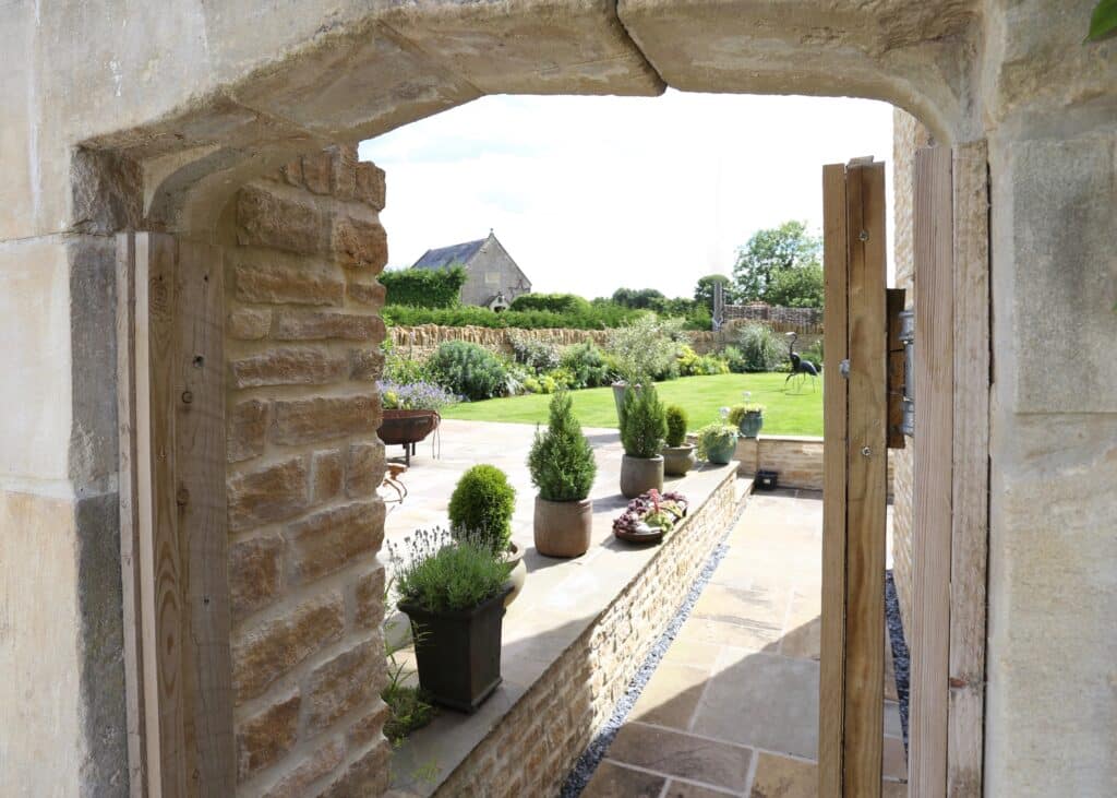 Stone arched external doorway to walled garden