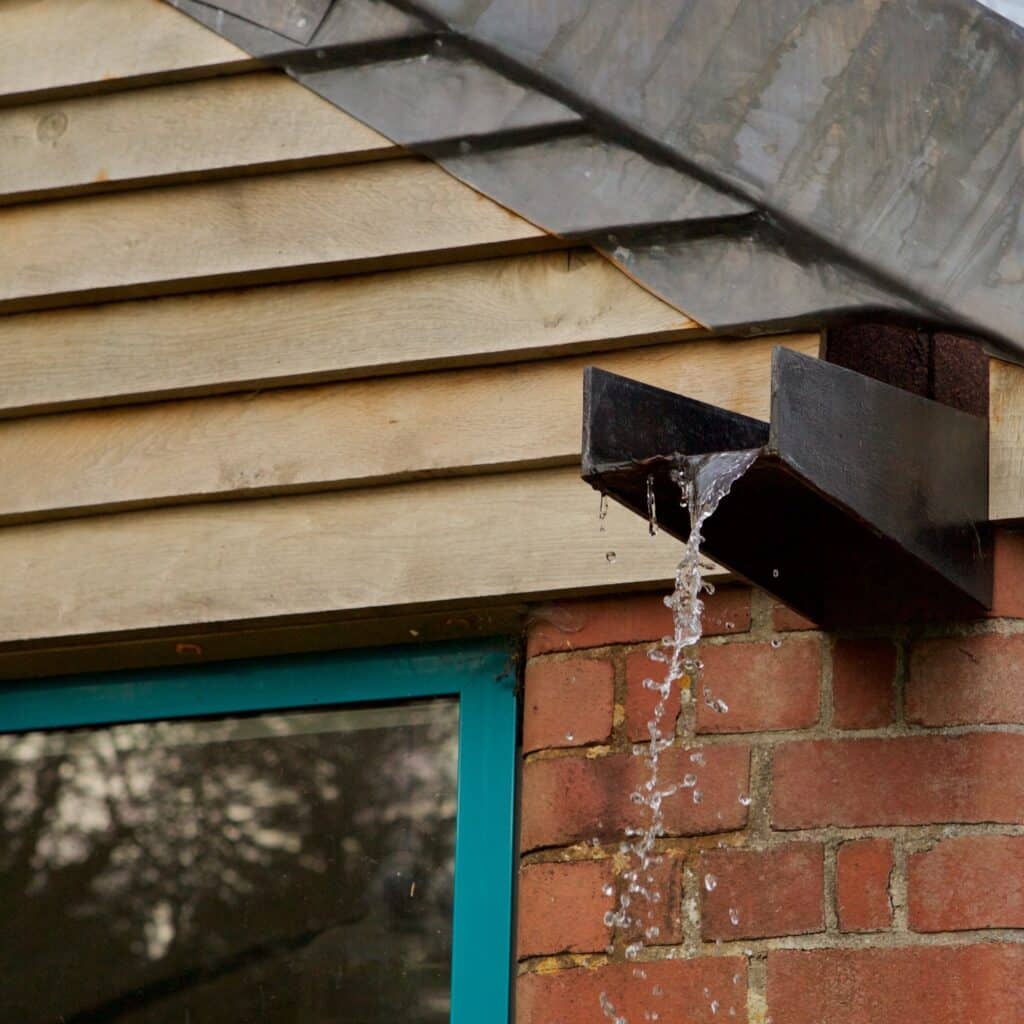 overhanging gutter and timber clad